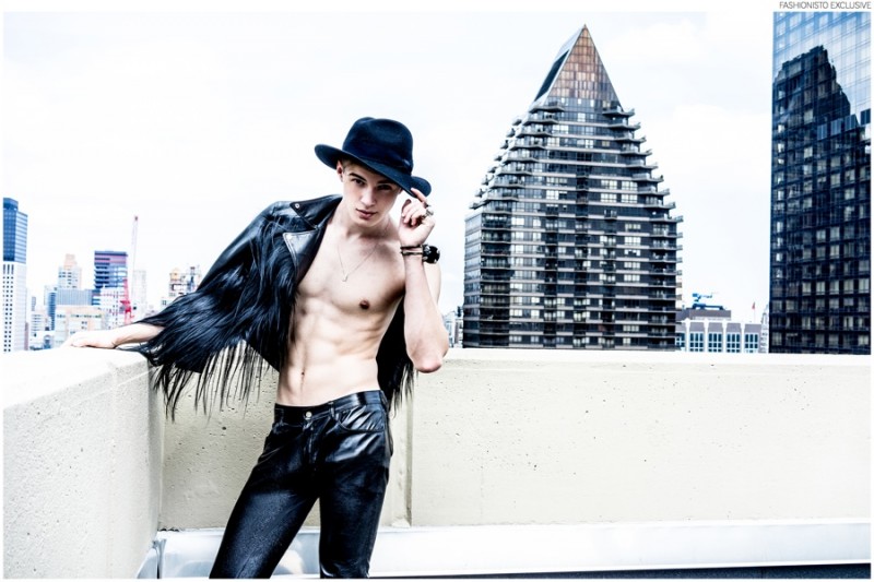 Frederico wears jacket Carolina Sarria, pants Tripp NYC, vintage necklace stylist's own and hat Zara.