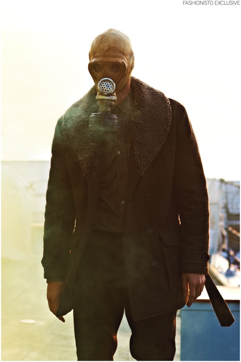 Al wears gas mask stylist's own, tweed jacket, pocket shirt and trousers Gieves & Hawkes.