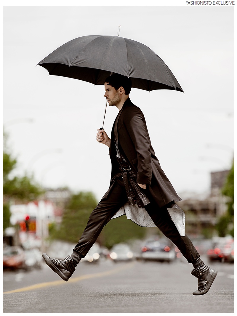 Isaac wears coat and pants Dubuc, t-shirt Diesel, shirt Saint Laurent by Hedi Slimane and shoes Diesel.