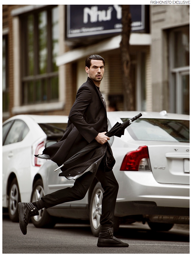 Isaac wears coat and pants Dubuc, t-shirt Diesel, shirt Saint Laurent by Hedi Slimane and shoes Diesel.