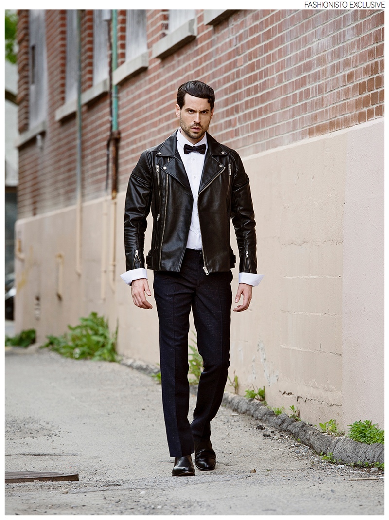 Isaac wears shirt Comme des Garçons Play, leather jacket La Marque, wool pants Circle of Gentlemen, boots Saint Laurent by Hedi Slimane and bow-tie Jil Sander.