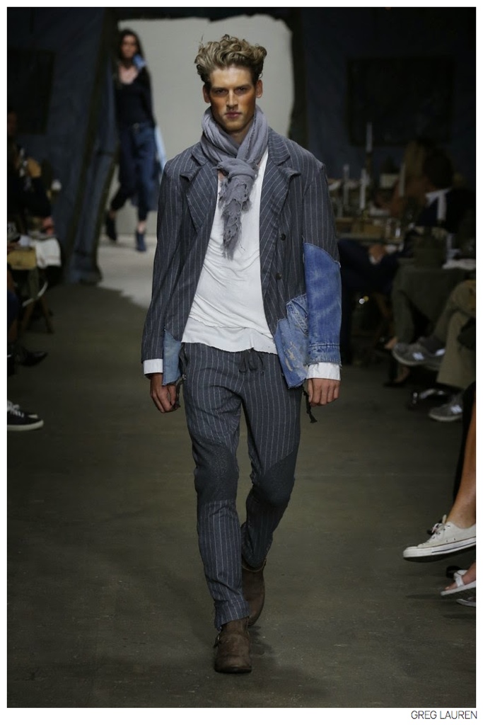 Designer Greg Lauren embraces an old world flair with a knotted scarf that accompanies relaxed suiting.