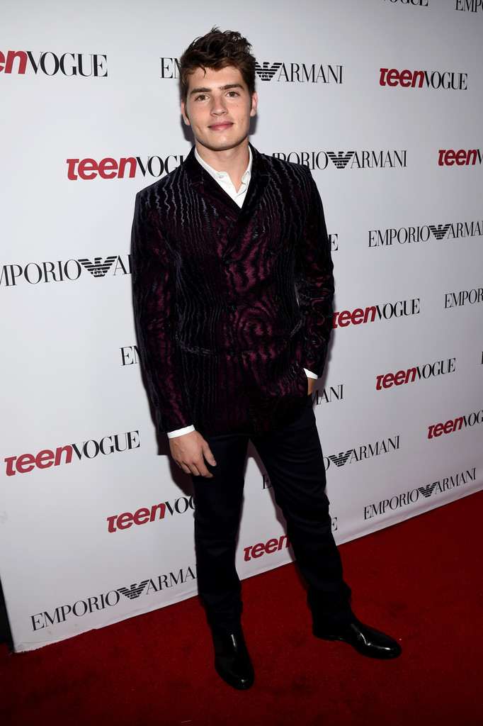 Attending Teen Vogue's Young Hollywood party on September 26, 2014 in Beverly Hills, California, actor Gregg Sulkin dressed to impress in a bold printed number from Emporio Armani.