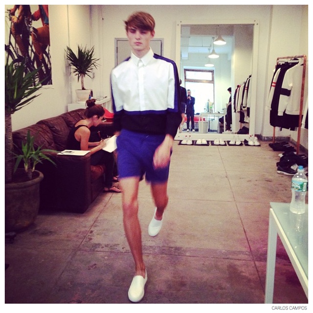 Guerrino Santulliana wears a spring/summer 2015 look during the fitting.