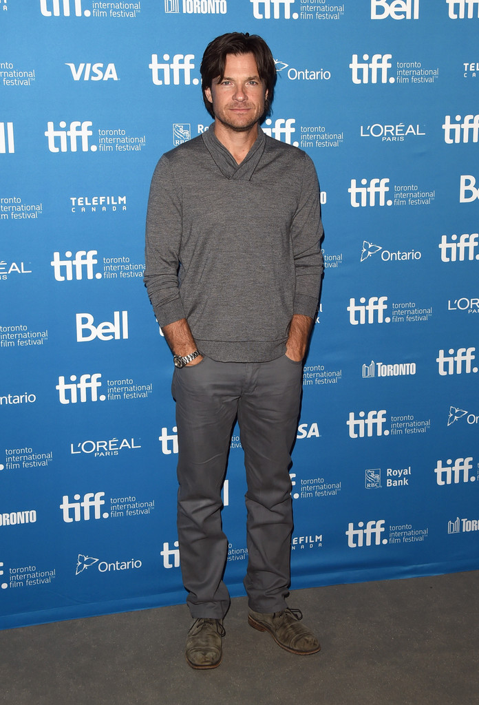Attending the press conference for 'This Is Where I Leave You' during the Toronto International Film Festival, Jason Bateman opted for a casual look in a color coordinated gray ensemble. Bateman finished off a pair of chinos and suede boots with a fashion knit.