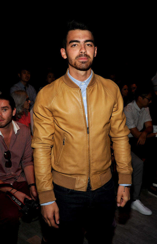 Joe wears Todd Snyder's leather varsity jacket.