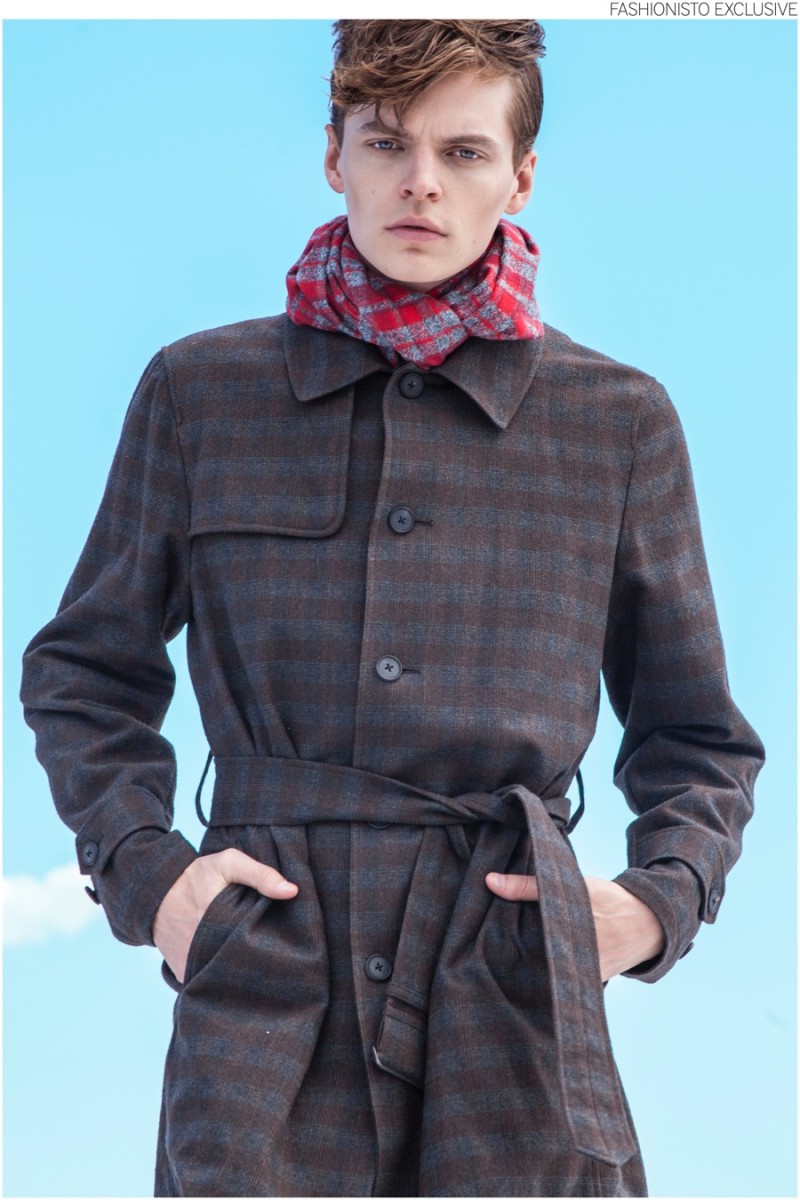 John wears plaid trench coat Robert Geller and scarf Jacqueline Rousseau. 
