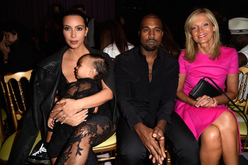 Attending the spring 2015 womenswear show of Givenchy, Kanye West sat front row with his wife Kim Kardashian and daughter North. For the occasion, West wore a black look from Givenchy's menswear collection.