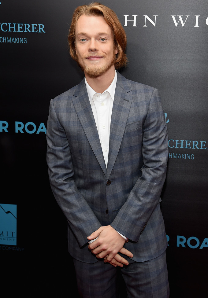 Attending the New York premiere of 'John Wick' on October 13, 2014, 'Game of Thrones' actor Alfie Allen hit the red carpet in a tailored two-button windowpane suit from French fashion label Louis Vuitton. Keeping it semi-casual, Allen opted for a clean, crisp white dress shirt sans tie.