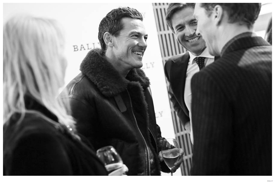 Trying on a Bally shearling jacket, Luke Evans is all smiles while chatting with Showing off his Bally Made-to-Color shoes, Bally CEO Frédéric de Narp and actor Benedict Cumberbatch.