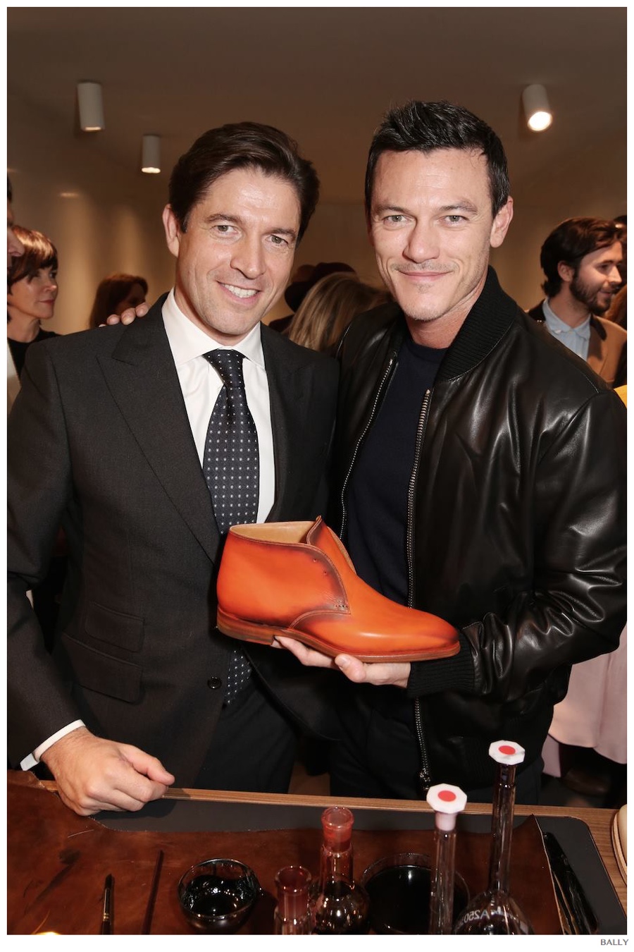 Showing off his Bally Made-to-Color shoes, Luke Evans poses with Bally CEO Frédéric de Narp.