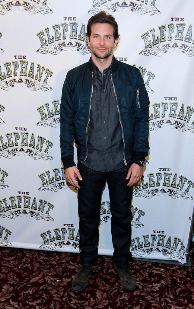 Wearing his favorite Dolce & Gabbana bomber jacket, actor Bradley Cooper kept his ensemble simple with a denim shirt and pair of jeans for 'The Elephant Man' photocall at Sardi's on October 21st.