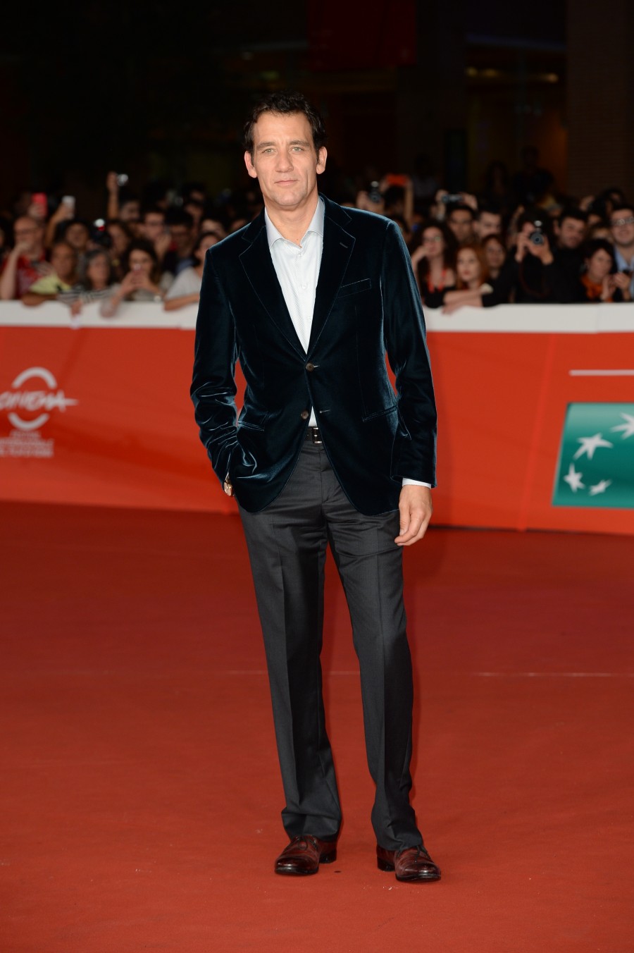 Promoting 'The Knick' during the Rome Film Festival, actor Clive Owen attended an October 17th screening of the Steven Soderbergh television series. For the fine evening out, Owen wore a Giorgio Armani green velvet jacket with a dress shirt and gray trousers.