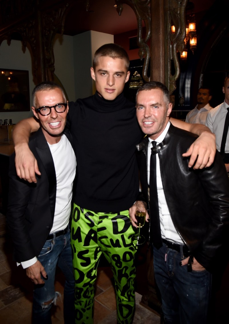 Dsquared2 designers Dan and Dean Caten pose with current model muse Silvester Ruck