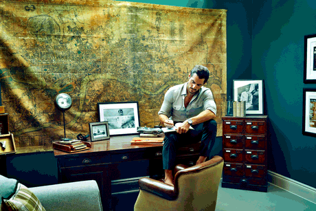 David Gandy poses in his study complete with a large old map of London.
