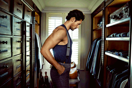 David Gandy looks over his custom drawers in his top floor walk-in wardrobe.