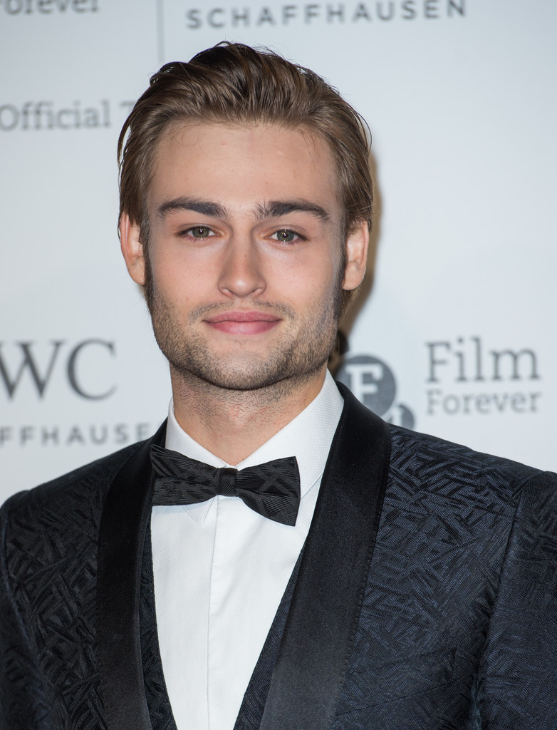 Attending the IWC Gala dinner in London on October 7, 2014, actor Douglas Booth was as dapper as usual, in a black silk jacquard tuxedo with vest, but what really stood out were his fine groomed thick eyebrows and sideburns.