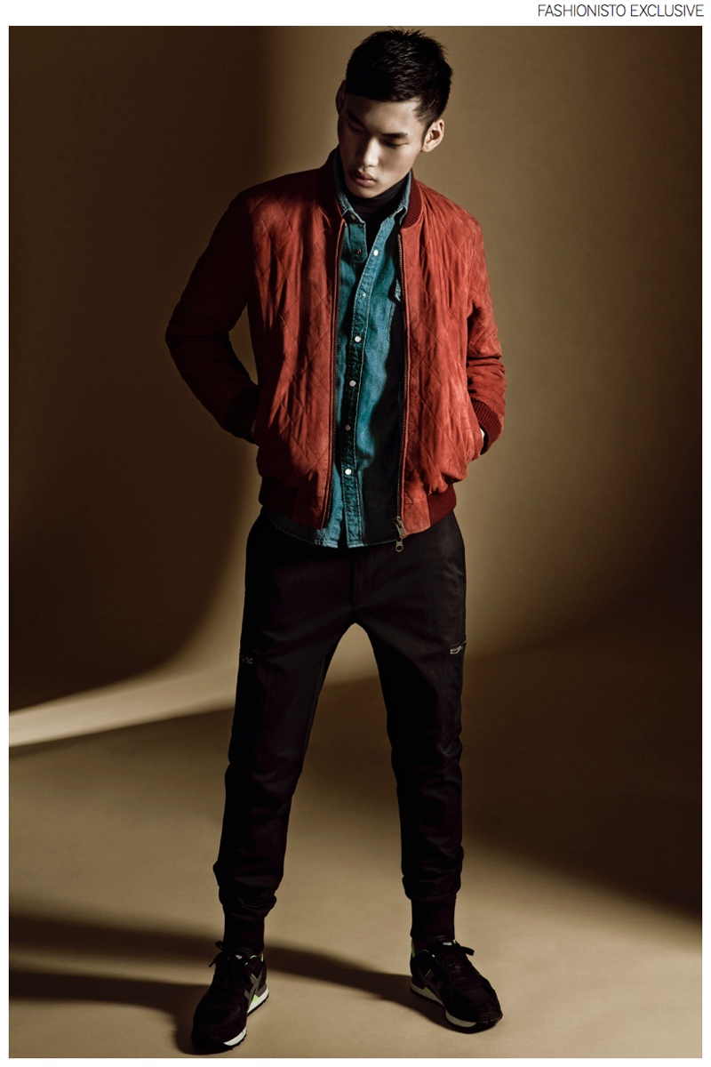 Chun wears jacket GANT, denim shirt Levi's, turtleneck sweater Sisley, trousers BOSS by Hugo Boss and sneakers Onitsuka.