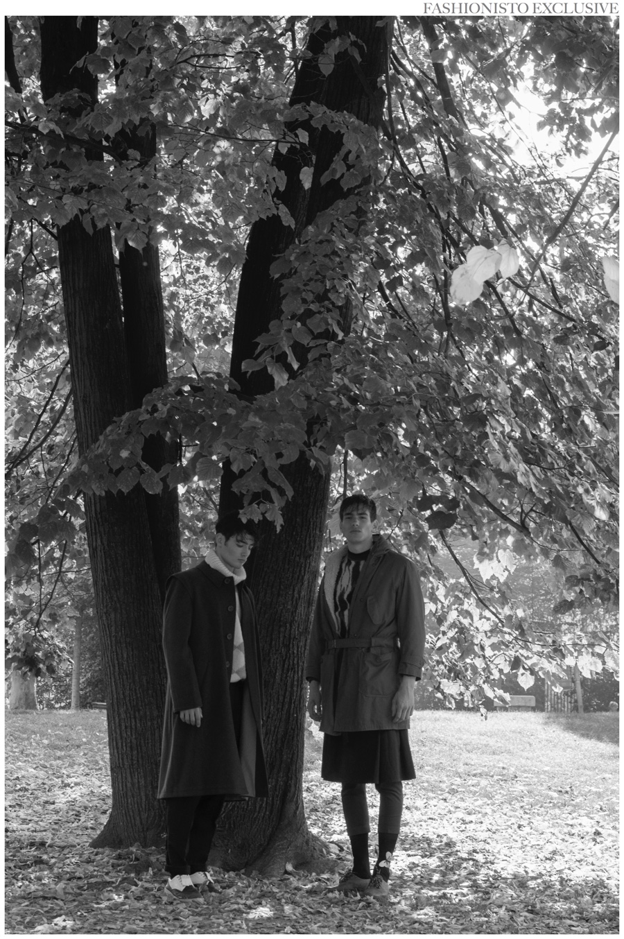 Left to Right: Andrei wears coat Jil Sander, turtleneck Missoni, pants stylist's own, socks Gallo and shoes Prada. Stanislaw wears coat Belstaff, sweater Missoni, skirt Comme des Garçons, pants COS, socks Gallo and shoes Farewell.