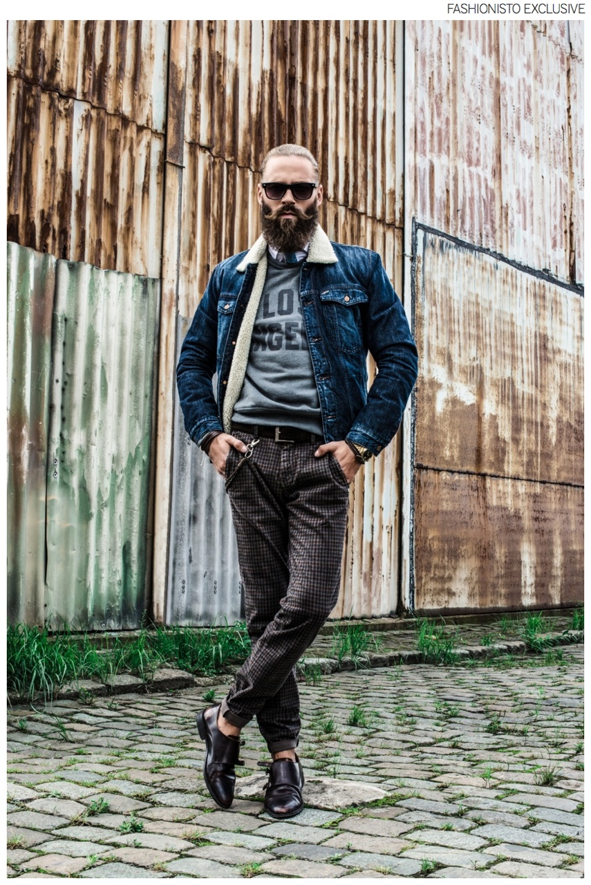 Laviniu wears tie Roda, pants Mason's, pullover and trucker jacket 7 For All Mankind.