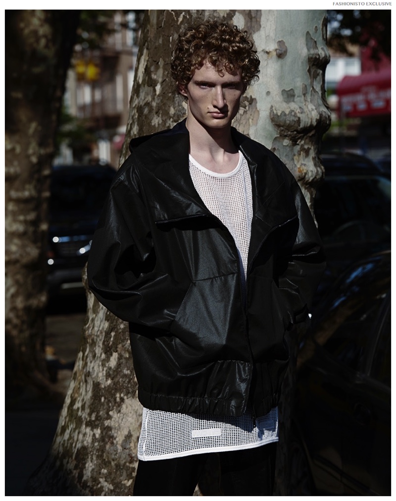 Luke wears waxed jacket Jil Sander, mesh tank Off-White and leather trousers Gucci.