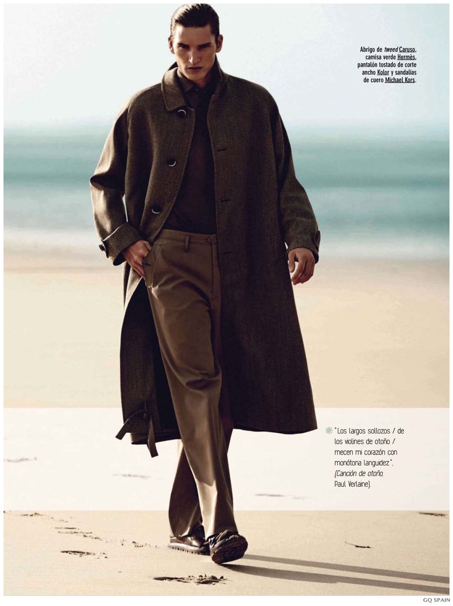 Gracing the pages of GQ España's November 2014 issue, model Dominik Bauer hits the beach with photographer Alvaro Beamed. Wearing luxurious fall fashions, Dominik dons grand coats as styled by Joana de la Fuente.