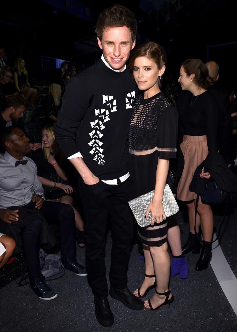 Actor Eddie Redmayne poses with actress Kate Mara. Redmayne wears a pullover from the Alexander Wang for H&M collection.