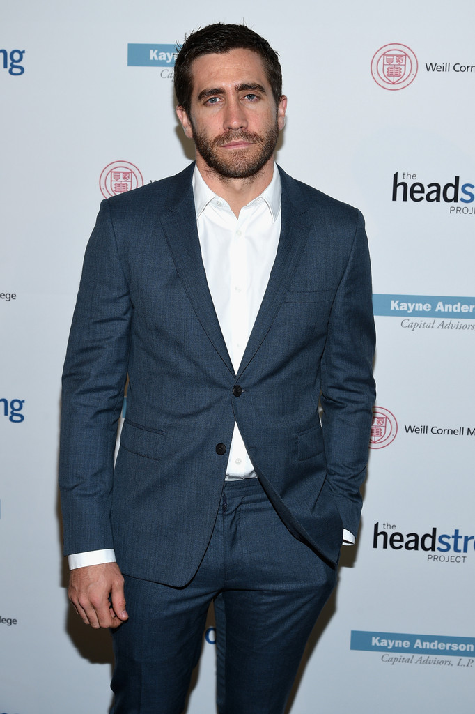 Attending The Headstrong Project 'Words of War' benefit on October 1, 2014 in New York City at the Tribeca 360, actor Jake Gyllenhaal dressed to impress in a tailored charcoal two-button suit sans tie.