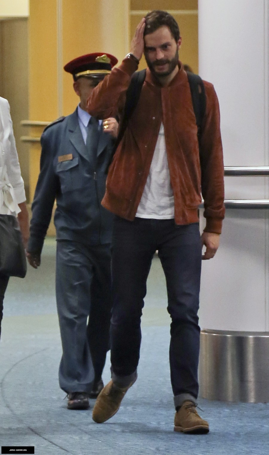 Arriving in Vancouver on October 11, 2014, Jamie Dornan showcased a smart casual ensemble with selvedge denim jeans and a classic white t-shirt paired with a suede bomber jacket and shoes. Dornan is in town to reshoot scenes for 'Fifty Shades of Grey', which comes out February 14, 2015.