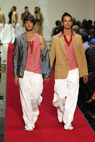 Spring 2005: Touching on the subject of gay marriage, Gaultier sent models down the wedding themed catwalk in fashionable pairs.