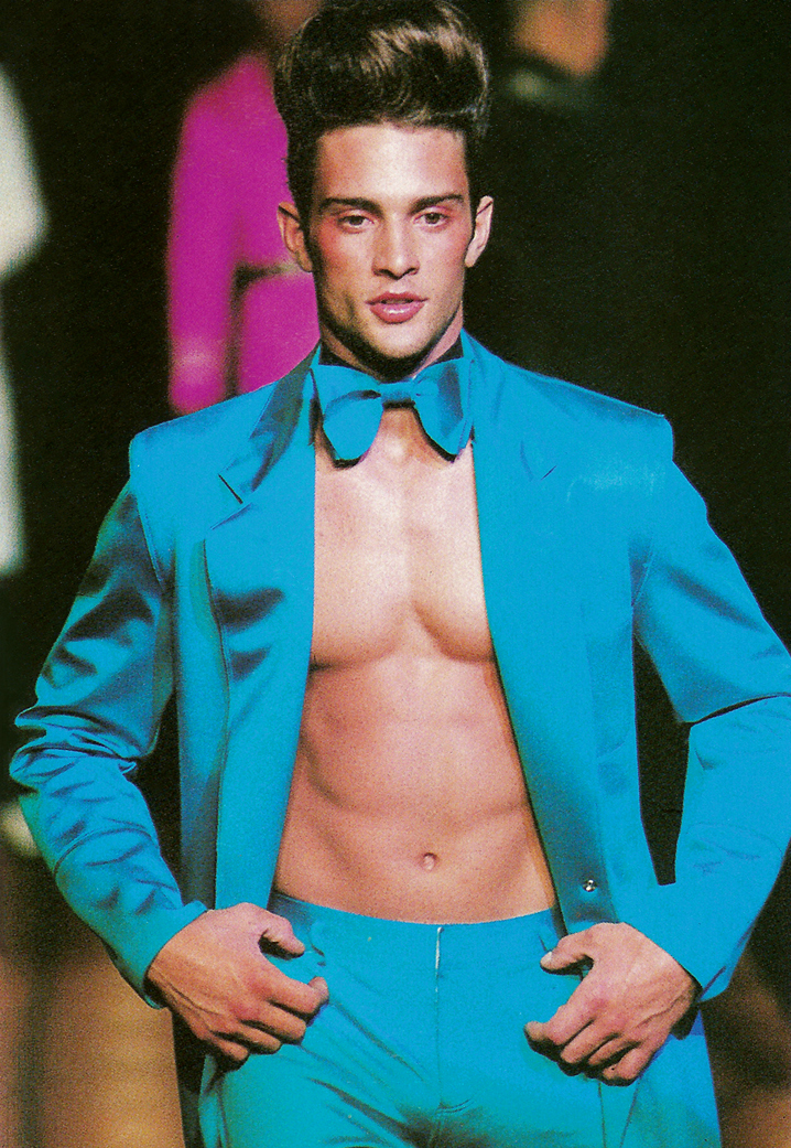 Spring 1996: Gaultier model muse turned actor David Fumero hits the catwalk in a colorful suit.