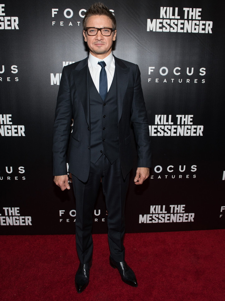 Attending a New York screening of 'Kill the Messenger' at the Museum of Modern Art on October 9th, actor Jeremy Renner was dashing in dark frames and a three-piece Dolce & Gabbana pinstripe suit, paired with a clean white shirt and silk tie.