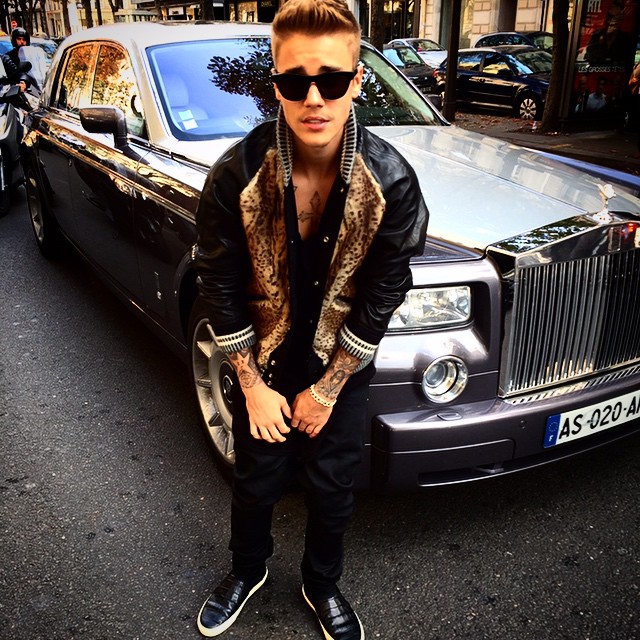 Earlier in the day, Bieber snapped a selfie wearing a leather wool leopard print bomber jacket from Saint Laurent.