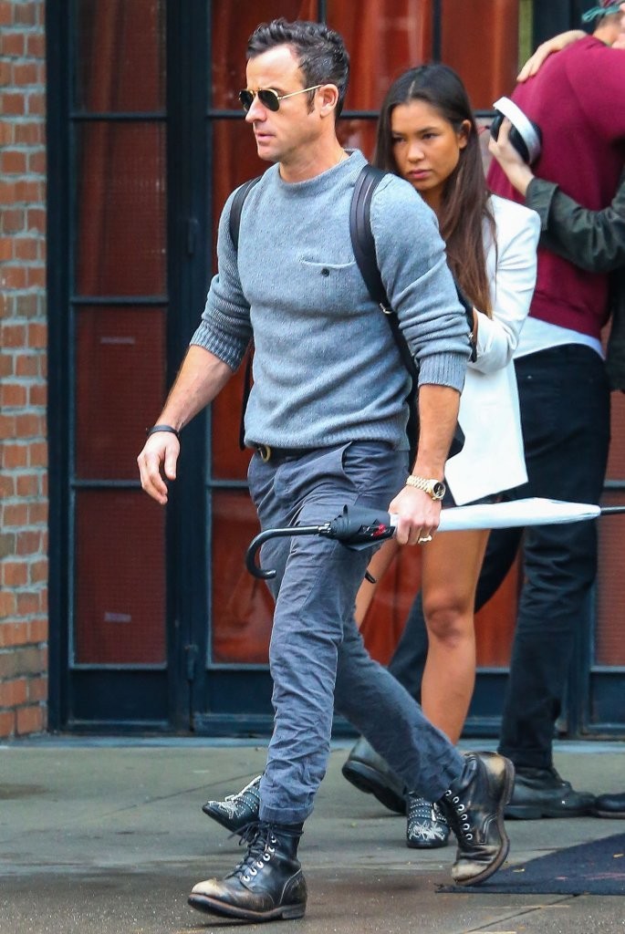 Captured out and about in New York City on October 16, 2014, actor Justin Theroux enjoyed the day's cool weather in Acne Studios' grey wool chet sweater, complete with a breast pocket featuring a button closure.