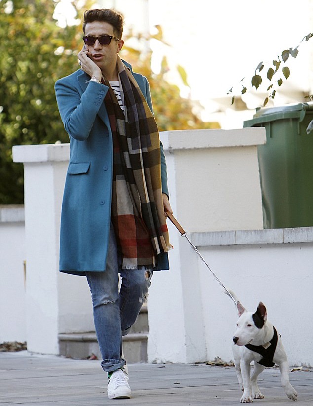 Spotted out and about, walking his dog in London on October 29th, British television personality Nick Grimshaw was quite the fall vision. Finishing a simple jeans and t-shirt look with an autumnal hued print scarf and Richard Nicoll 'Crombie' coat in turquoise, Grimshaw was an inspiring sight to take in.