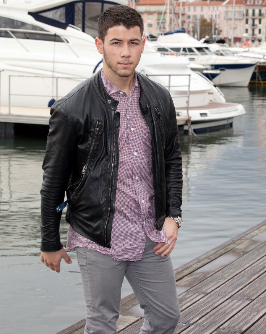 In France to promote his latest project 'Kingdom', 'Jealous' singer Nick Jonas attended a photo call, wearing a casual look from Ermenegildo Zegna. A little wrinkled, probably in part to a hectic schedule, Jonas wore a printed button-down with slim-cut pants and a leather moto jacket.