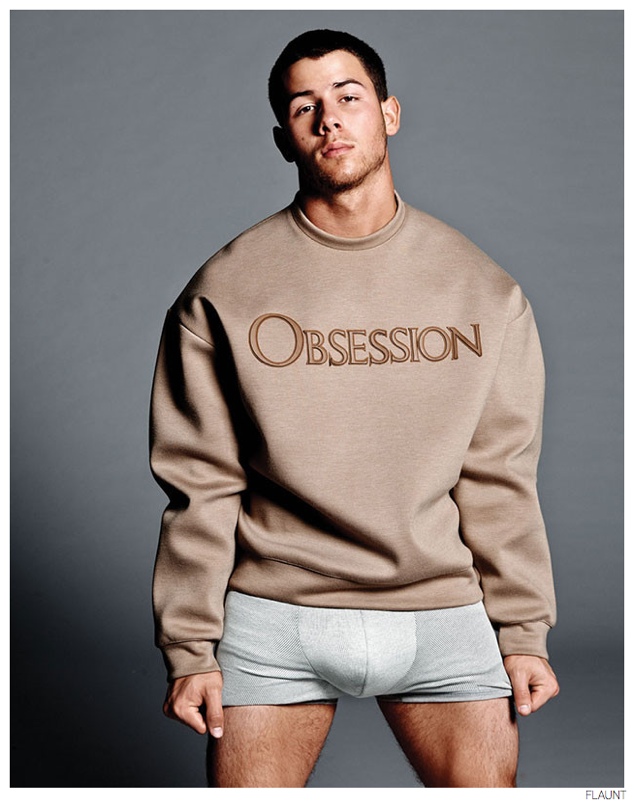 Nick Jonas wears Calvin Klein Collection's popular 'Obsession' sweatshirt.