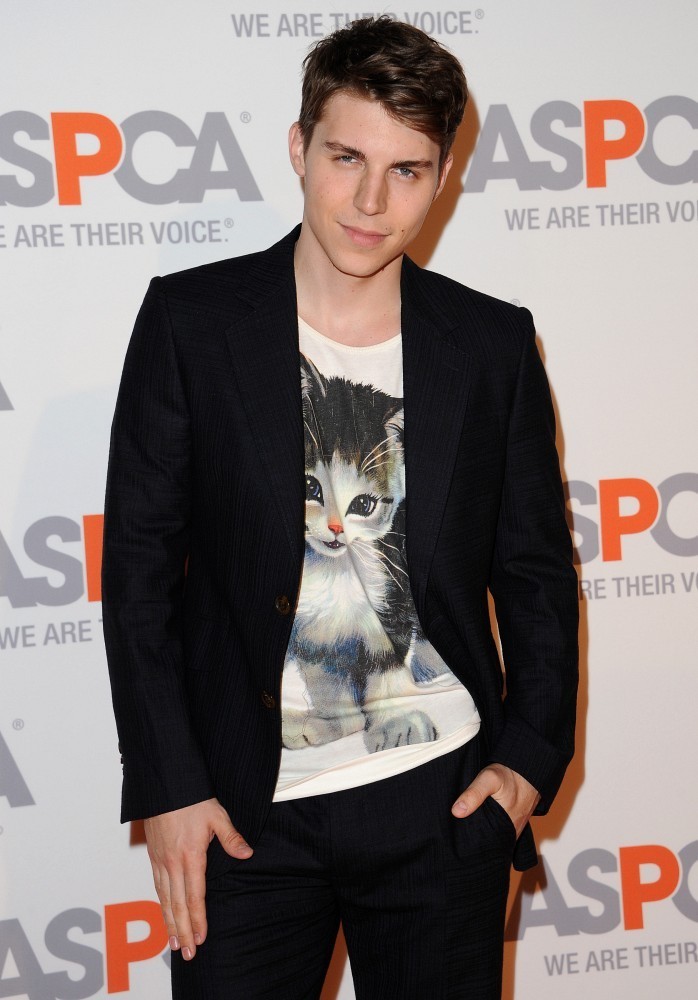 Sporting yet another look from British designer Vivienne Westwood, actor Nolan Gerard Funk make quite the statement at the ASPCA Compassion Awards in Bel-Air, California on October 22nd.  The actor paired a classic two-button suit with high-top sneakers and a kitten t-shirt from Vivienne Westwood's fall-winter 2014 collection.