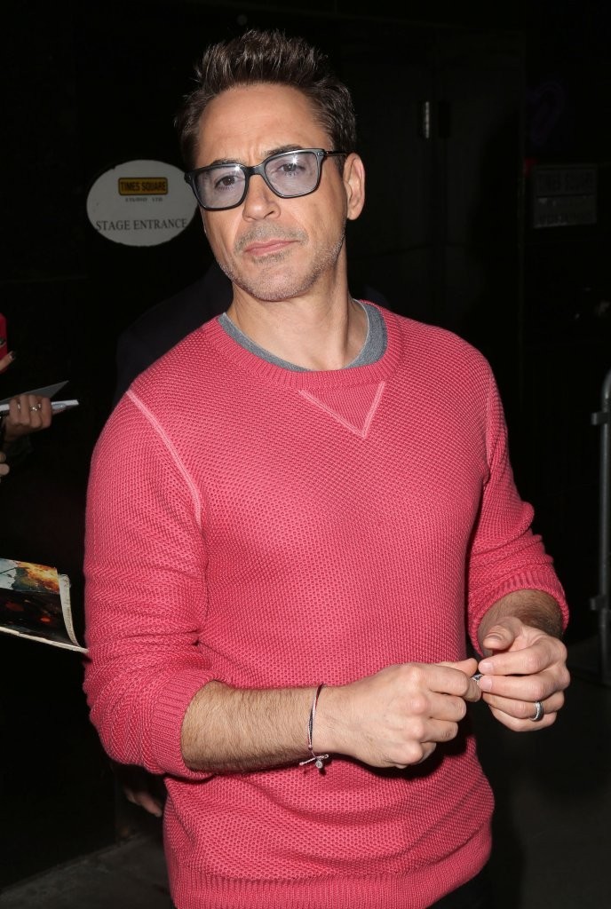 On October 8th, Robert Downey Jr. headed to ABC Studios for an appearance on 'Good Morning America', wearing a pink GANT Rugger sweater.
