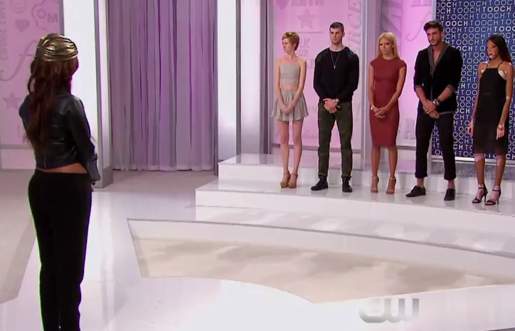 Tyra stands before eliminated contestants to announce who gets a second chance.