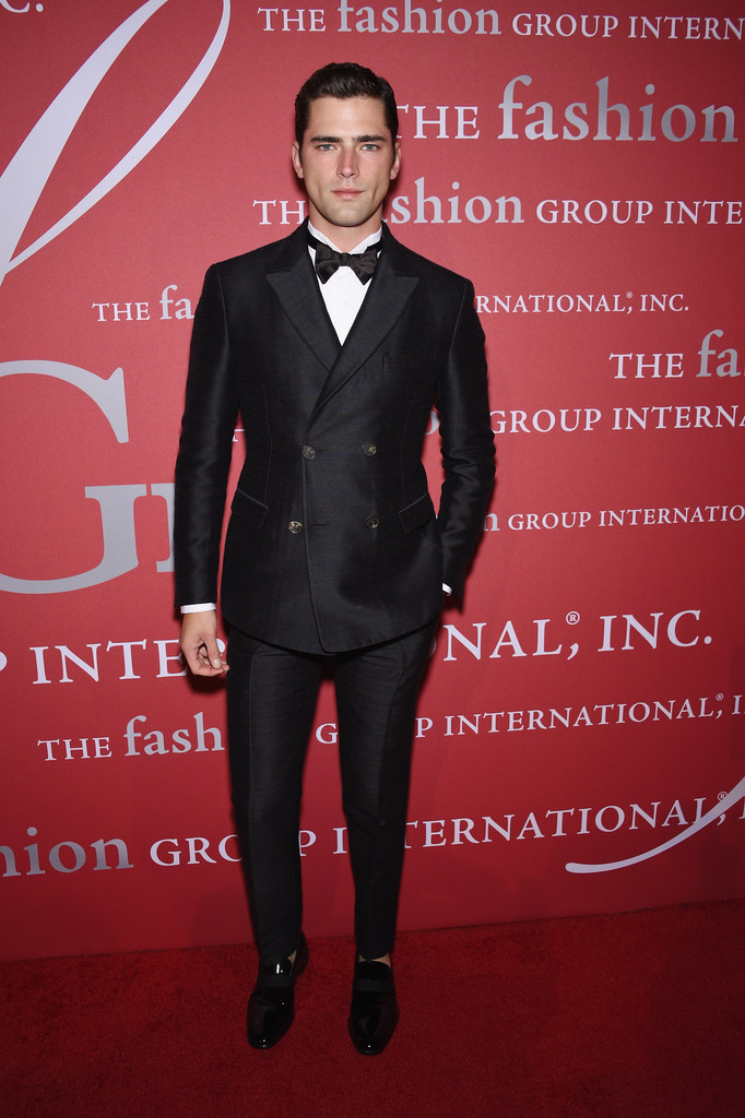 Attending the 31st Annual Fashion Group International Night of Stars gala in New York City last night, top American model Sean O'Pry dressed to impress, sporting a dapper evening look from Italian fashion house Salvatore Ferragamo. A former face of the brand, Sean was dashing in a fall-winter 2014 look that consisted of a double-breasted charcoal and pinstripe evening jacket and trousers, paired with a white tuxedo shirt and patent leather shoes.