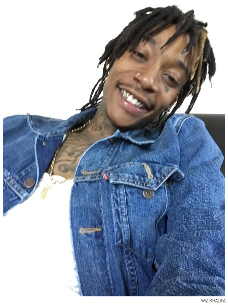 Wiz Khalifa pictured on October 6th in a Levi's denim jacket, shares a smiling image on social media.