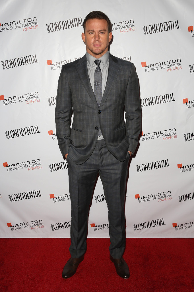Hot on the heels of filming 'Magic Mike XXL', Channing Tatum touched down in Los Angeles, California on November 9th to attend the 2014 Hamilton Behind the Camera Awards. Sporting a dapper suit from Giorgio Armani, Tatum made a sartorial statement in gray.