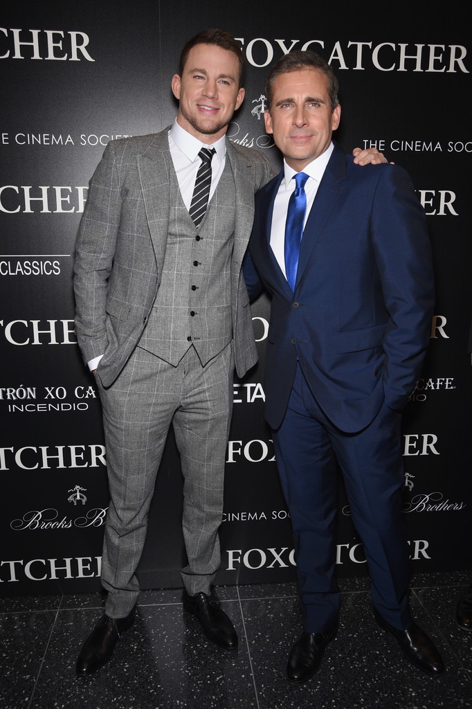 Attending a screening of 'Foxcatcher' on November 11th in New York City, Channing Tatum posed for a photo with fellow actor Steve Carell. For the occasion, Tatum cleaned up in a light charcoal windowpane print three-piece suit from Dolce & Gabbana. He completed his look with a black and white striped tie.