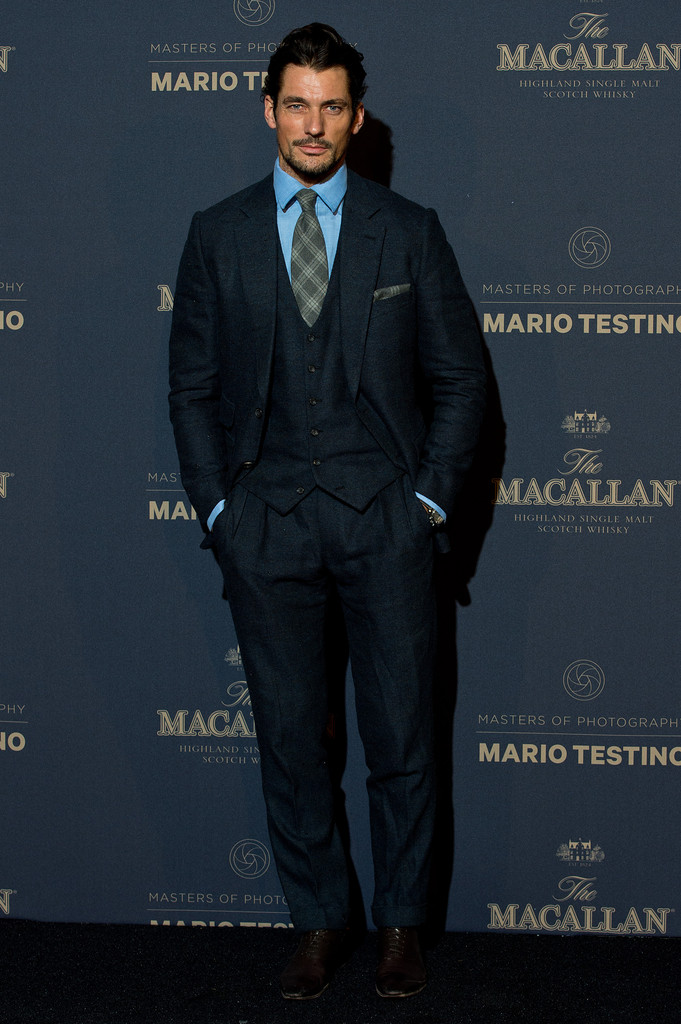 British model David Gandy stepped out with a dapper flair on November 12th to support the launch of The Macallan Masters of Photography: Mario Testino Edition in London. Posing for photos, David wore a three-piece suit with a matching plaid tie and pocket scarf.