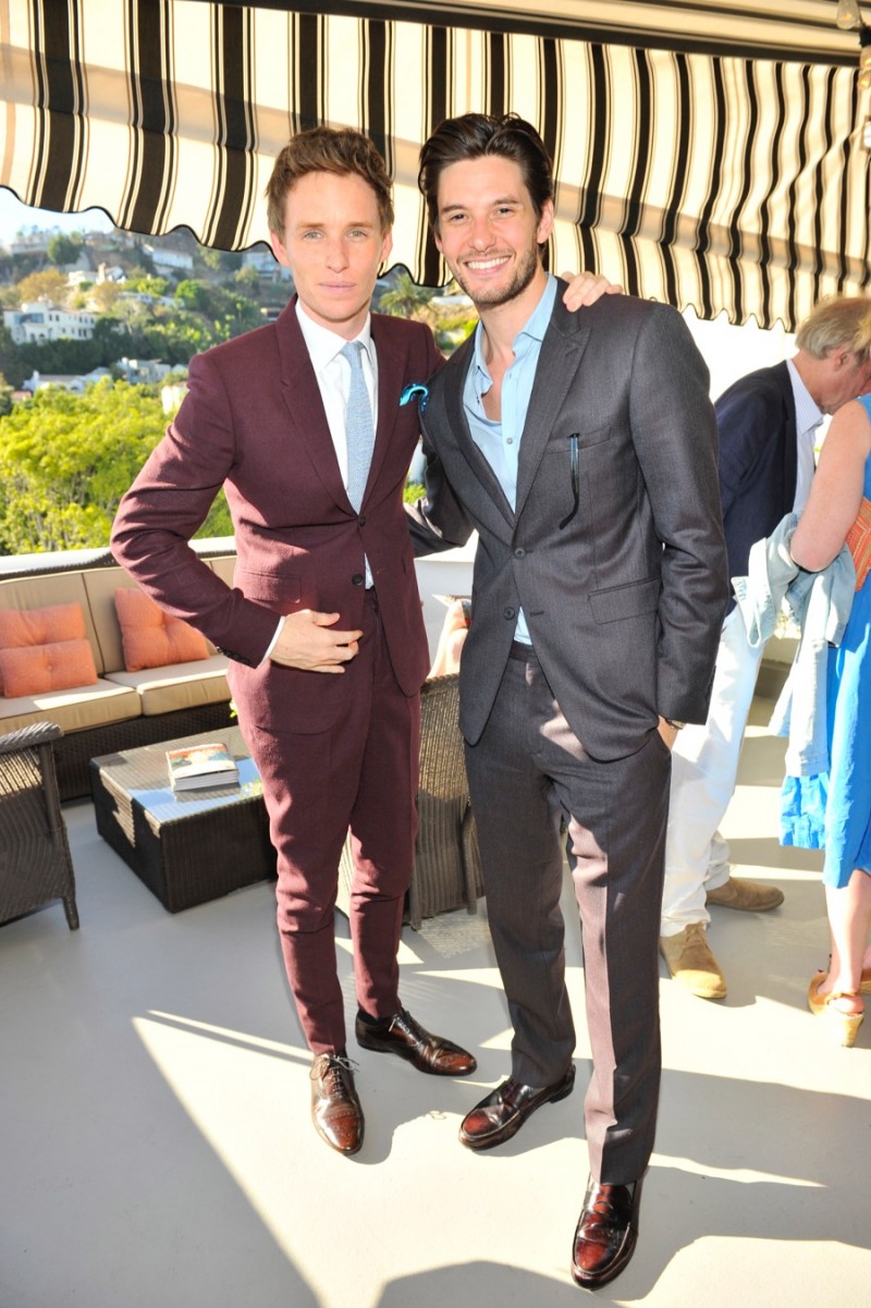 Both wearing Burberry suits, acts Eddie Redmayne and Ben Barnes pose for a photo.