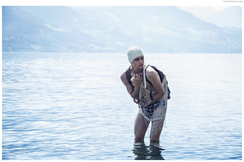 Joel wears vintage cap, backpack H&M and swimsuit Speedo.