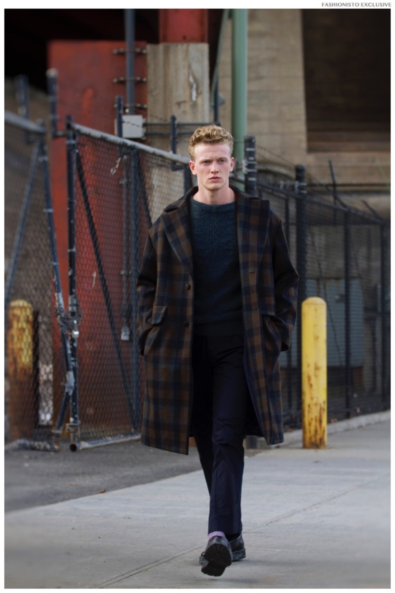 George wears coat Z Zegna, sweater Salvatore Ferragamo, pants and shoes Emporio Armani.