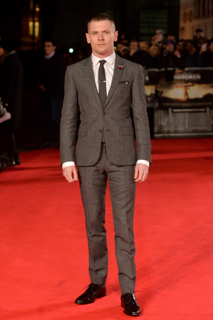 Attending the November 25th London premiere of 'Unbroken', directed by Angelina Jolie, actor Jack O'Connell made a logical style decision. Hitting the red carpet, he represent quintessential British style with a smart, tailored suit from Burberry Tailoring.