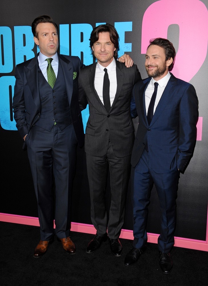 Posing with co-stars Charlie Day and Jason Sudeikis at the November 20th Hollywood premiere of 'Horrible Bosses 2', actor Jason Bateman stood out in a black wool, two-button notch lapel suit with silver silk stripes from French fashion label Dior Homme.